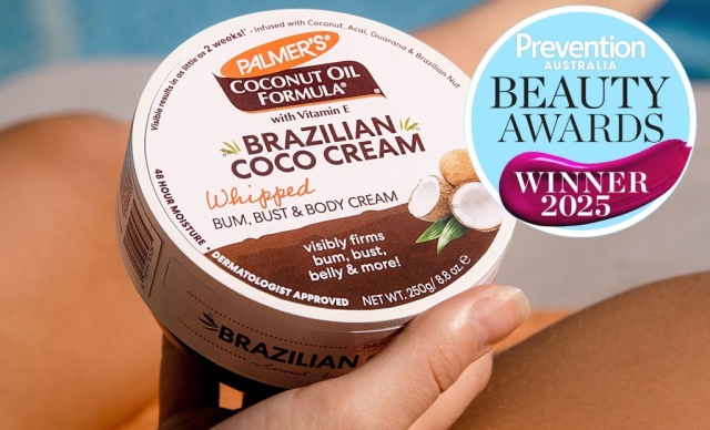 Close-up of a person next to the pool holding Palmer's Brazilian Coco Cream